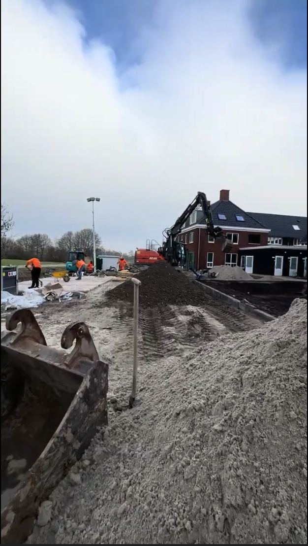 Worker laying cobblestones